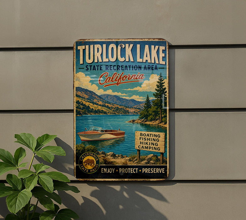 A vintage metal sign for Turlock Lake, California, featuring a scenic illustration of the lake and surrounding landscape.