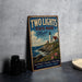 A vintage-style metal sign for "Two Lights State Park, Maine" is displayed on a gray countertop, featuring a lighthouse and ocean views.