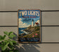 A vintage-style metal sign for "Two Lights State Park Maine" is displayed on a wall, featuring a lighthouse and a coastal landscape.