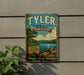 A vintage-style metal sign for Tyler State Park in Pennsylvania, featuring a scenic landscape with a lake, mountains, and trees.