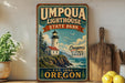 a vintage-style sign for Umpqua Lighthouse State Park, with a lighthouse and coastal scenery, placed on a shelf next to a wooden cutting board and some lemons.