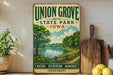 A vintage-style sign for Union Grove State Park in Iowa, featuring a scenic landscape with a lake, trees, and a path.