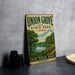 A vintage-style metal sign for Union Grove State Park in Iowa, featuring a scenic landscape with a lake, trees, and a path.
