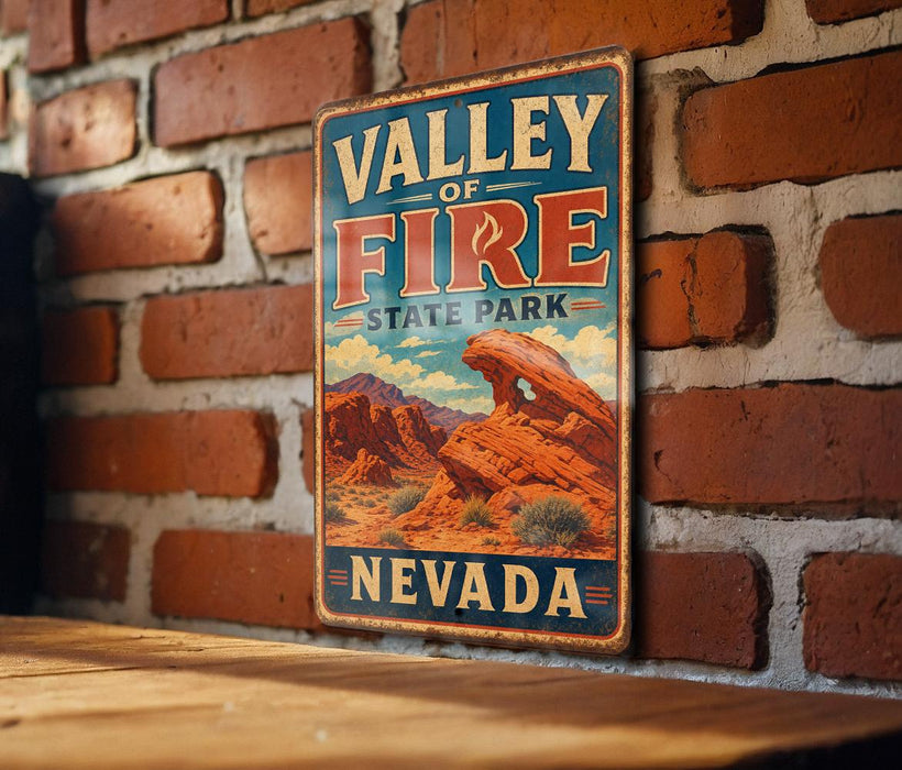 A vintage-style metal sign for Valley of Fire State Park in Nevada, featuring a desert landscape with mountains and a prominent rock formation.
