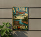 A vintage-style sign for Victoria Bryant State Park in Georgia, featuring a scenic landscape with a lake, mountains, and trees.