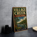 A vintage-style metal sign for "VILLAGE CREEK STATE PARK TEXAS" is displayed on a gray concrete surface, with a stack of black camera lenses and a white dish nearby.