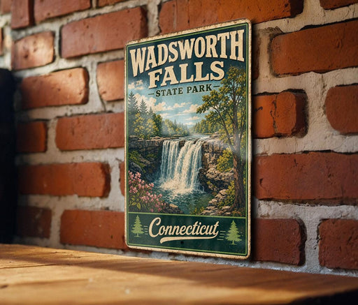 A vintage metal sign for Wadsworth Falls State Park in Connecticut, featuring a scenic image of the waterfall surrounded by lush greenery.
