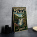 A vintage metal sign for Wadsworth Falls State Park in Connecticut, featuring a scenic illustration of the waterfall surrounded by trees and flowers.