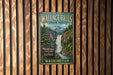A vintage metal sign for Wallace Falls State Park in Washington, featuring a waterfall surrounded by pine trees and mountains.