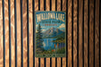 A vintage-style metal sign for Wallowa Lake State Park, Oregon, featuring a scenic mountain landscape with a lake and colorful wildflowers.