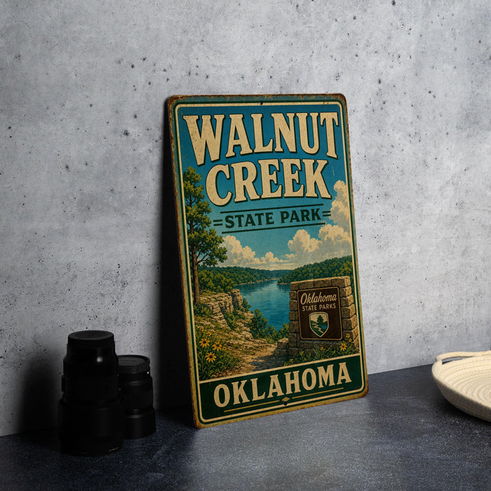 A vintage-style sign for Walnut Creek State Park in Oklahoma, featuring a scenic landscape with a lake and mountains.