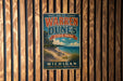 A vintage-style metal sign for Warren Dunes State Park in Michigan, featuring a beach scene and the text "Beauty, adventure, memories" and "Michigan Where the Dunes Meet the Dream".