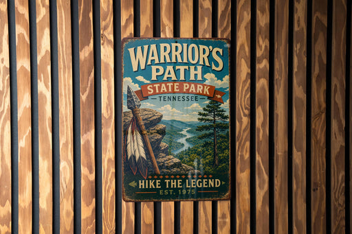 A vintage metal sign for Warrior's Path State Park in Tennessee, featuring a scenic illustration of a mountain landscape with a river and a Native American feather headdress.