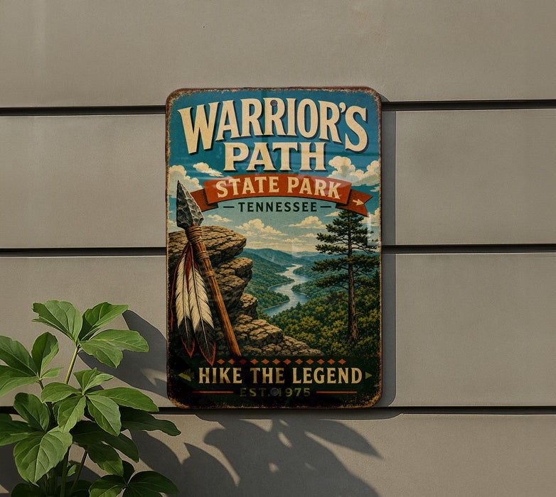 A vintage-style metal sign for Warrior's Path State Park in Tennessee, featuring a scenic mountain landscape with a river and a Native American headdress.