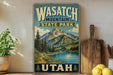 A vintage-style poster of Wasatch Mountain State Park in Utah, featuring a scenic mountain landscape with a lake and pine trees.