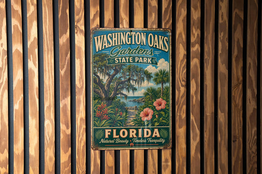 A vintage-style metal sign for Washington Oaks Gardens State Park in Florida, featuring a tropical landscape with palm trees, flowers, and a body of water.