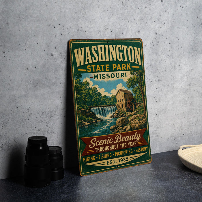 A vintage-style metal sign for Washington State Park, Missouri, featuring a scenic illustration of a waterfall and a mill.