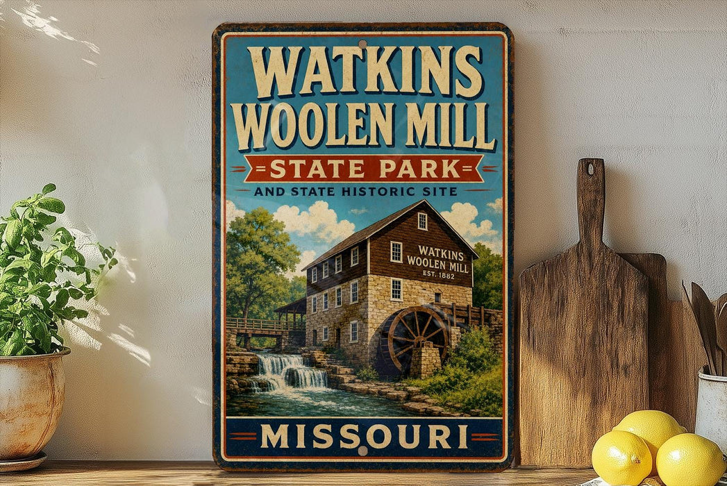 A vintage-style sign for Watkins Woolen Mill State Park in Missouri, featuring an illustration of a mill with a waterfall.