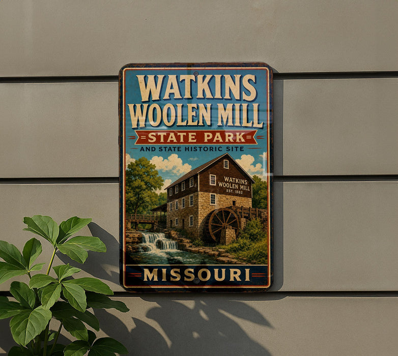 A metal sign for Watkins Woolen Mill State Park in Missouri, featuring an illustration of the mill and a waterfall.