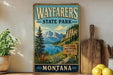 A vintage-style sign for Wayfarers State Park in Montana, featuring a scenic mountain landscape with a lake and pine trees.