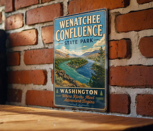 A vintage-style metal sign for Wenatchee Confluence State Park, featuring a scenic landscape with a river and mountains.