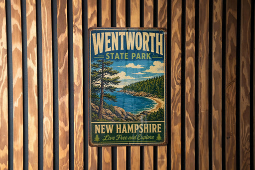 A vintage metal sign for Wentworth State Park in New Hampshire, featuring a scenic landscape with a lake, mountains, and pine trees.