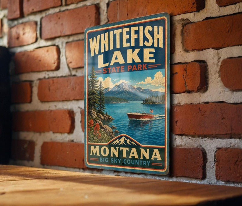 A vintage-style metal sign for Whitefish Lake State Park in Montana, featuring a scenic landscape with a lake, mountains, and a boat on the water.