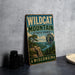 A vintage-style metal sign for Wildcat Mountain State Park in Wisconsin, featuring a scenic landscape with a lake and mountains.