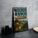 A vintage metal sign for Wilder Ranch State Park in California, featuring a scenic landscape with a house, trees, and a path leading to the park.