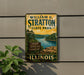 A vintage-style metal sign for William G. Stratton State Park in Illinois, featuring a scenic landscape with a river and mountains.
