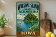 A vintage-style sign for Wilson Island, Iowa, featuring a scenic landscape with a lake, a heron, and flowers.