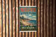 A vintage-style metal sign for Wilson State Park, featuring a scenic landscape with a beach, mountains, and pine trees.