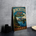 A vintage-style metal sign for Winchester Lake State Park in Idaho, featuring a scenic landscape with mountains, trees, and a lake.