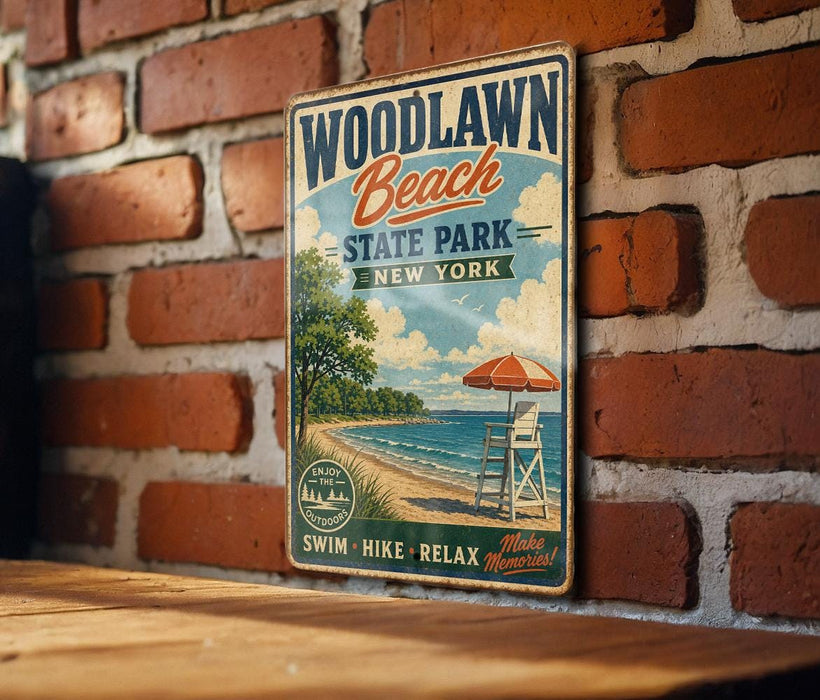 A vintage-style metal sign for Woodlawn Beach State Park in New York, featuring a beach scene with a lifeguard chair and an umbrella.