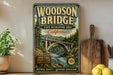 A vintage-style sign for the Woodson Bridge in California, featuring a scenic illustration of the bridge surrounded by trees and a river.