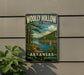 A vintage-style sign for Wolly Hollow State Park in Arkansas, featuring a scenic landscape with a lake, mountains, and a sailboat.