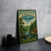 A vintage-style metal sign for Wrentham State Forest, featuring a scenic illustration of a forest landscape with a river and pine trees.