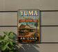 A vintage-style sign for Yuma Quartermaster Depot, a historic park in Arizona, featuring a wagon and a desert landscape.