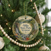 A round ornament on a Christmas tree, featuring a scenic landscape with a waterfall and mountains, with the text "Allis State Park, Vermont" displayed prominently.