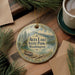 A decorative ornament with the text "Alta Lake State Park, Washington" on it, surrounded by pine branches and a cup of coffee on a wooden surface.