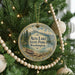A round ornament hanging on a Christmas tree, featuring a scenic image of Alta Lake State Park in Washington.