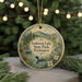 A round ornament with a scenic landscape of Anderson Lake State Park, Washington, featuring a duck swimming in the water and pine trees in the background.