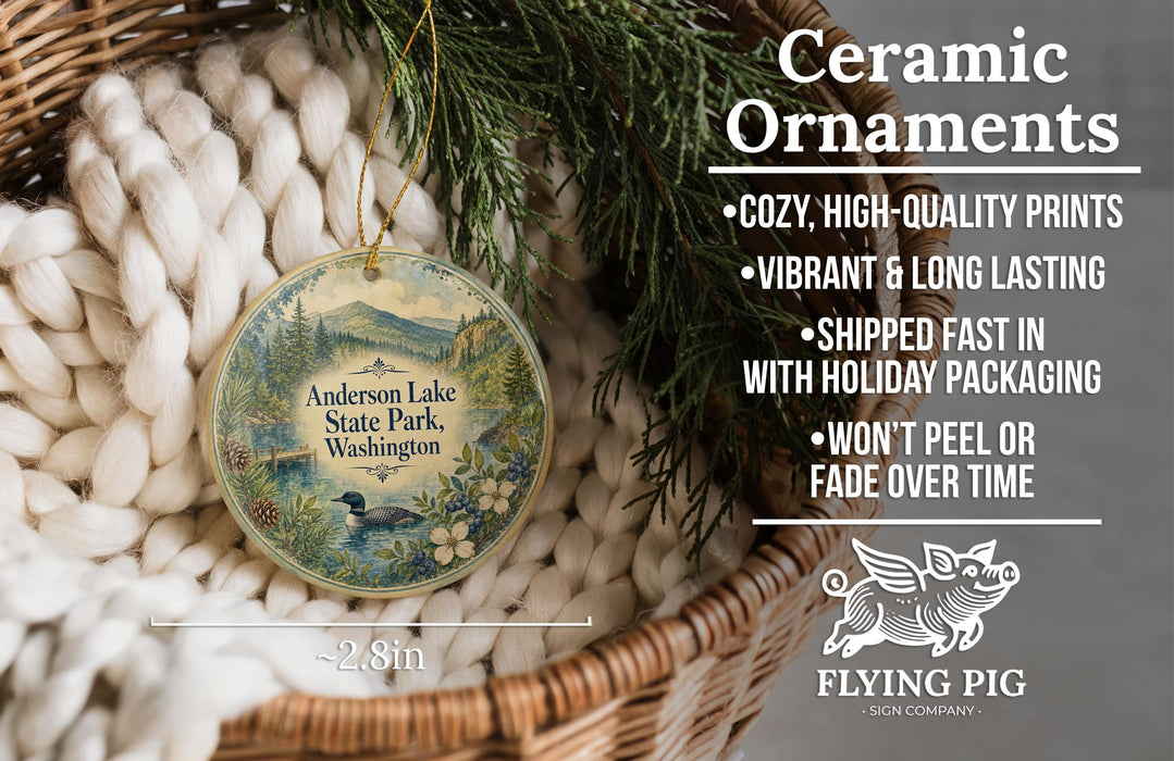 Ceramic ornaments, featuring a detailed image of Anderson Lake State Park, Washington, with a bird and flowers. The ornaments are described as cozy, high-quality prints, vibrant, and long-lasting, and are shipped fast in holiday packaging. They are not to be peeled or faded over time.