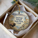 A decorative ornament in a box, featuring an illustration of Antelope Island, State Park, Utah, with a bison and a gazelle in the background.