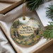 An oval ornament with a scenic landscape of Audra State Park, West Virginia, hanging from a string.