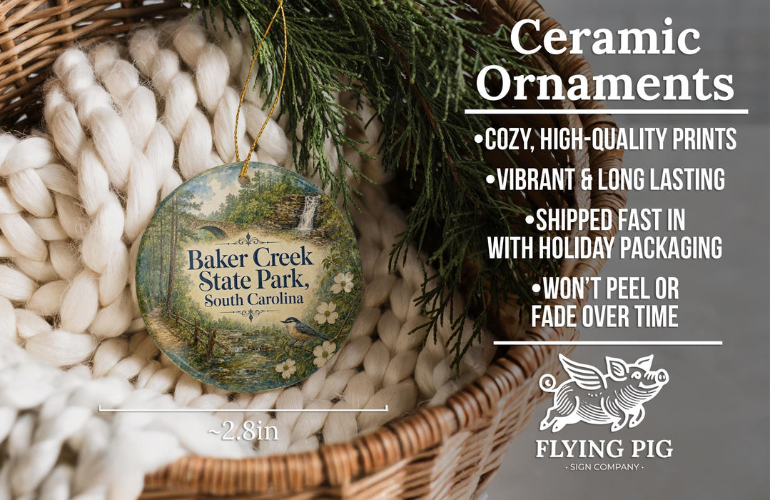 Ceramic ornaments, featuring a round ornament with a scenic image of Baker Creek State Park, South Carolina, hanging from a wicker basket.
