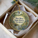 A decorative ornament in a box, featuring a scenic image of the Bass River State Forest in New Jersey.