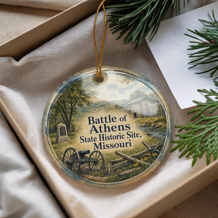 A decorative ornament with a scene depicting a cannon, a wooden fence, and a building, along with the text "Battle of Athens State Historic Site, Missouri".