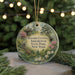 A round ornament with a garden scene and text, hanging on a string.