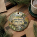 A round ornament with a painting of Bear Brook State Park, New Hampshire, featuring a bear, pine trees, and a stream.
